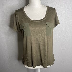 Green top with pocket detail sheer back top is‎ see thru